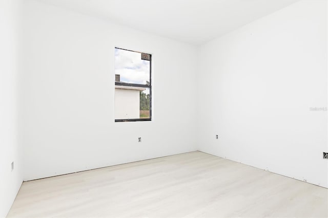 empty room with light hardwood / wood-style floors