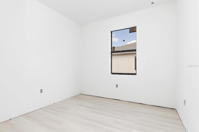 unfurnished room with light hardwood / wood-style flooring