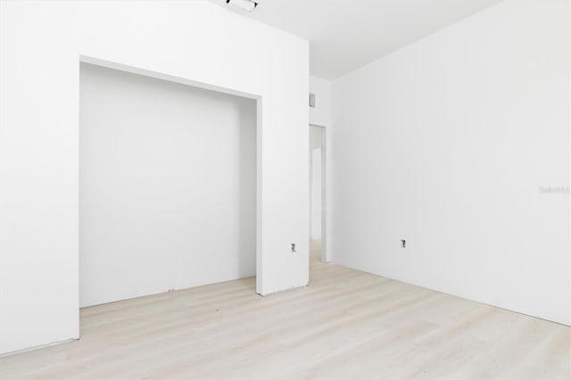 empty room with light wood-type flooring