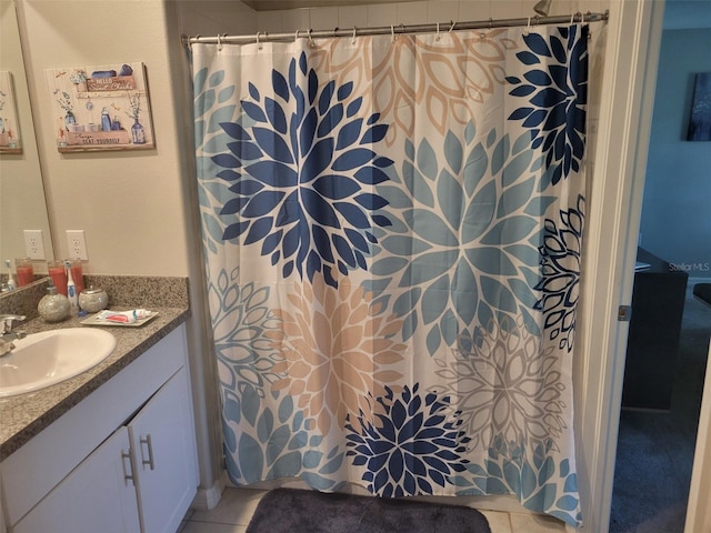 bathroom featuring tile flooring and vanity