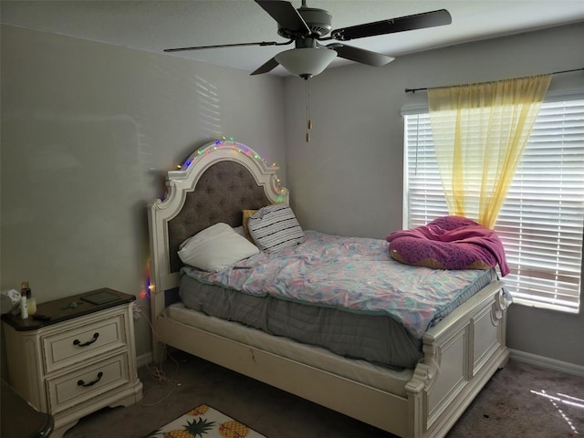 carpeted bedroom with ceiling fan