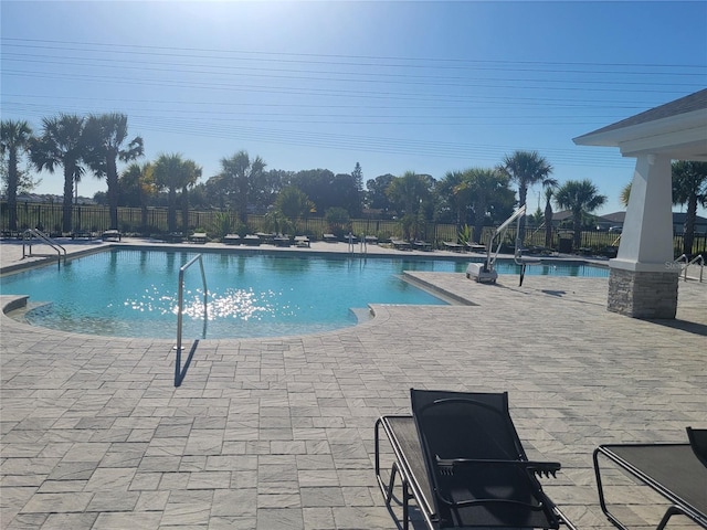 view of swimming pool with a patio area