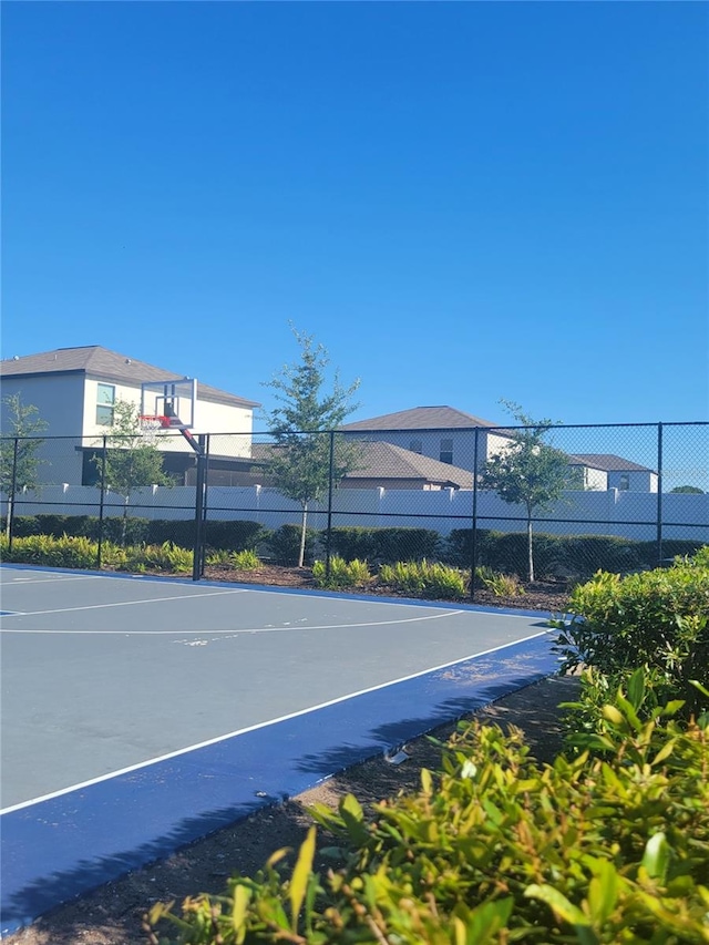 view of sport court with basketball hoop