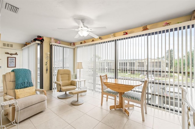 sunroom featuring ceiling fan