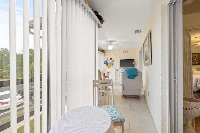 interior space with ceiling fan