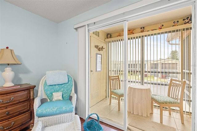 sitting room with light tile flooring