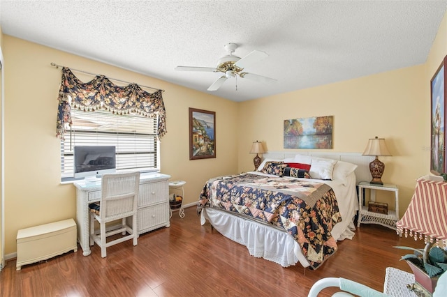 bedroom with dark hardwood / wood-style flooring, ceiling fan, and a textured ceiling