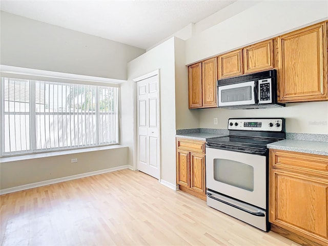 kitchen with light hardwood / wood-style flooring and stainless steel appliances