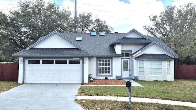 view of front facade featuring a garage and a front lawn