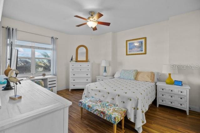 bedroom featuring dark hardwood / wood-style flooring and ceiling fan