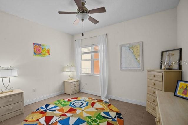 rec room featuring ceiling fan and light tile flooring