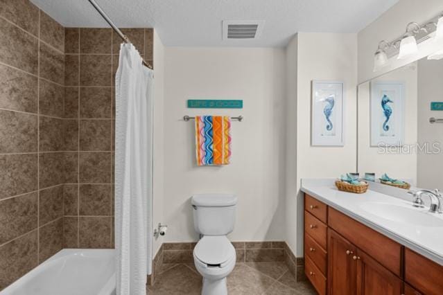 full bathroom with tile flooring, shower / bathtub combination with curtain, toilet, and vanity