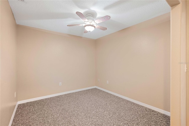 empty room featuring carpet flooring and ceiling fan