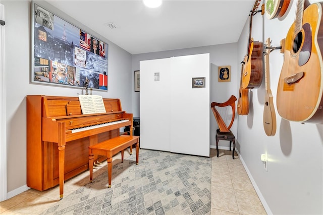 miscellaneous room featuring light tile patterned floors