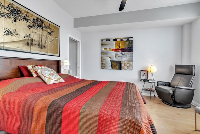 bedroom with hardwood / wood-style floors and ceiling fan