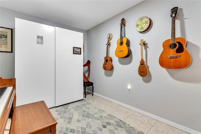 foyer entrance with light tile patterned floors