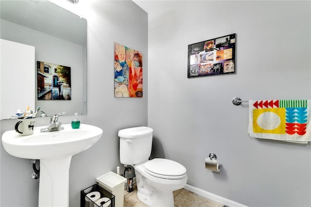 bathroom with tile patterned floors and toilet