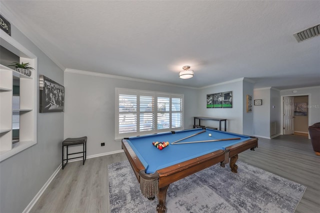 game room with billiards, wood-type flooring, and ornamental molding