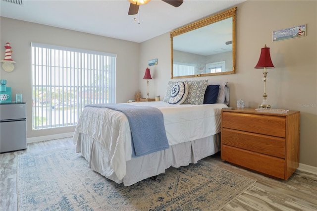 bedroom featuring light hardwood / wood-style flooring and ceiling fan