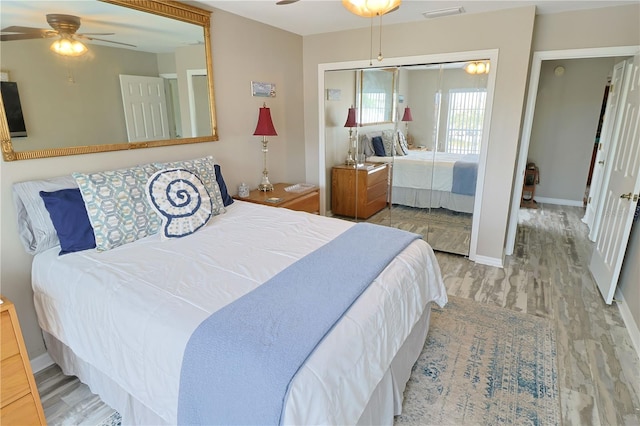 bedroom featuring a closet, ceiling fan, and light wood-type flooring