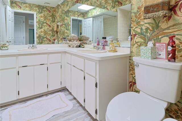 bathroom featuring toilet and oversized vanity