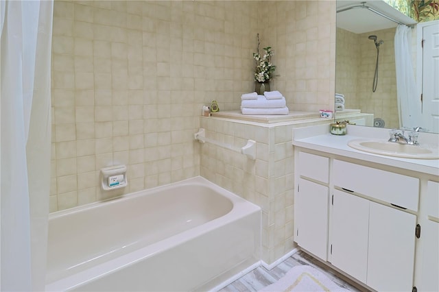 bathroom with wood-type flooring, large vanity, and shower / bath combo