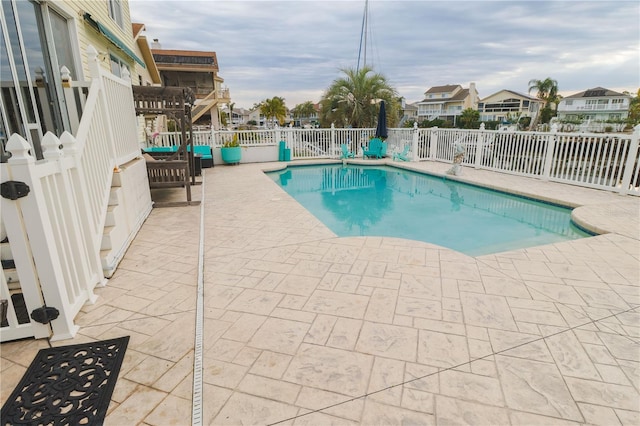 view of swimming pool featuring a pergola and a patio area