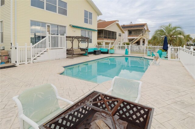 view of pool featuring a patio area