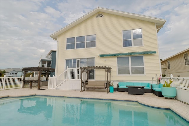 back of property featuring a patio area, an outdoor hangout area, and a pergola