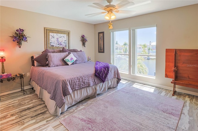 bedroom featuring wood-type flooring and ceiling fan