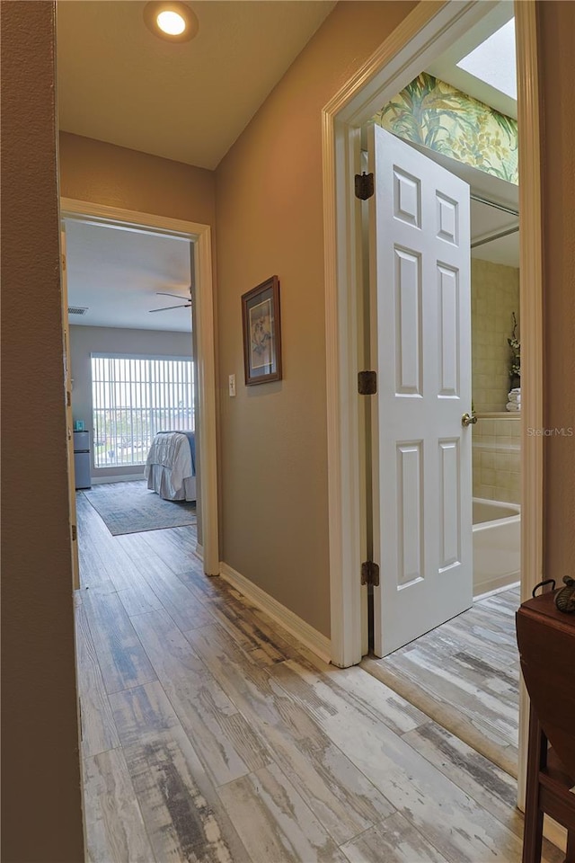 hall featuring light hardwood / wood-style floors