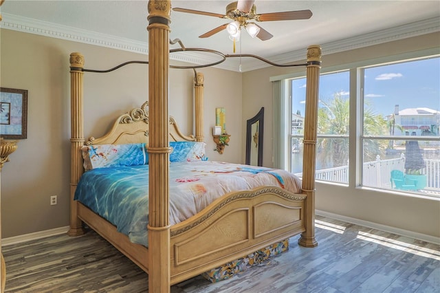 bedroom featuring crown molding, dark hardwood / wood-style flooring, and ceiling fan