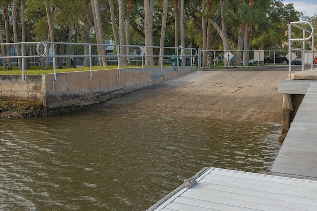 dock area featuring a water view