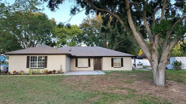 ranch-style house with a front lawn