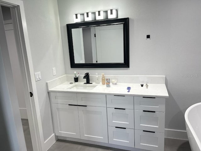 bathroom with a bathing tub and vanity