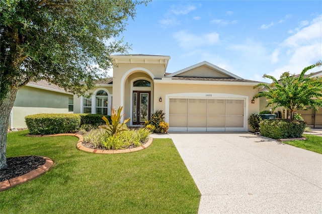 view of front facade with a front lawn and a garage