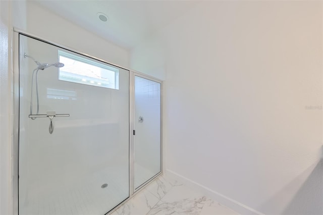 bathroom featuring an enclosed shower