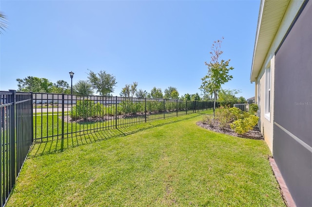 view of yard with central AC