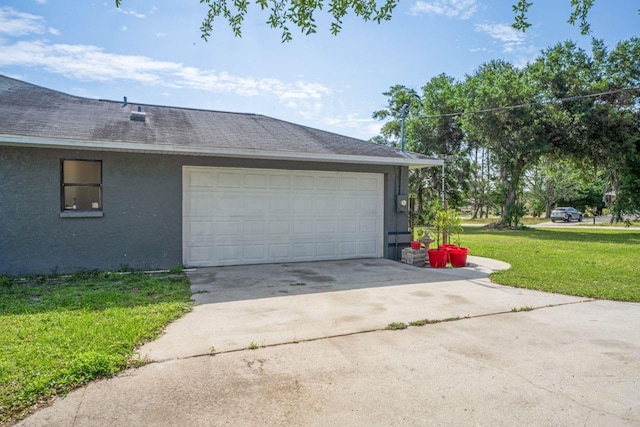 garage featuring a yard