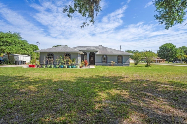 back of property featuring a lawn