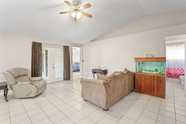 tiled living room with ceiling fan, vaulted ceiling, and french doors