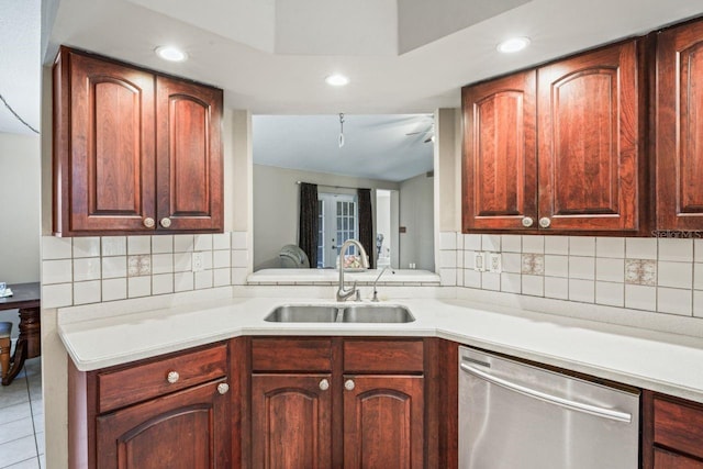 kitchen with dishwasher, light tile patterned flooring, sink, and tasteful backsplash