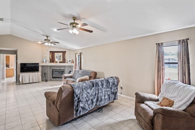 living room with light tile patterned floors, vaulted ceiling, and ceiling fan