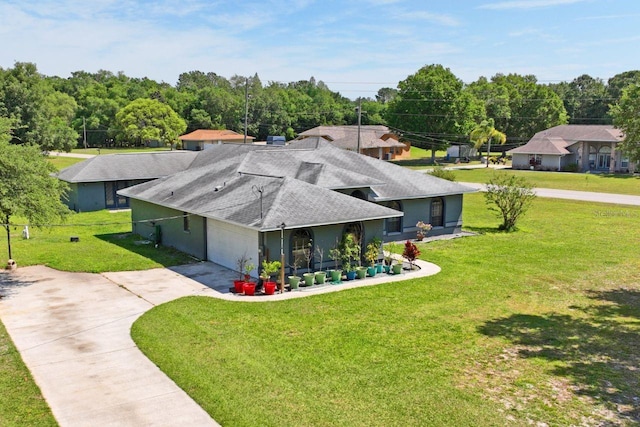 exterior space with a lawn and a garage