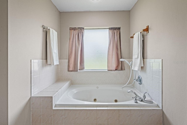 bathroom with tiled bath