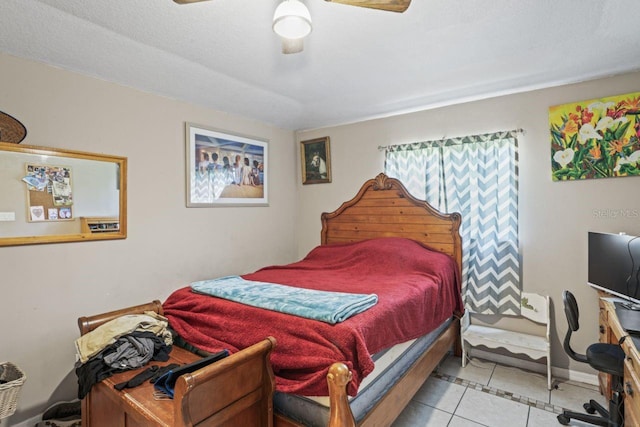 bedroom with ceiling fan and light tile patterned floors