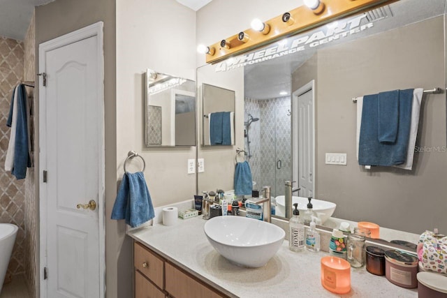 bathroom with vanity and a shower with shower door