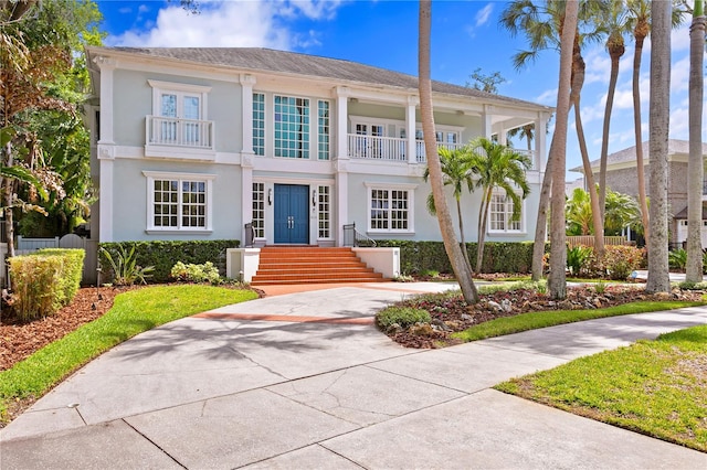 view of front of home with a balcony