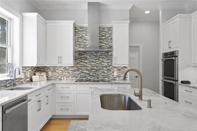 kitchen featuring backsplash, wall chimney range hood, and stainless steel appliances