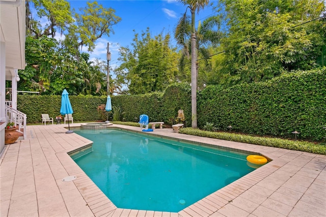 view of swimming pool featuring a patio